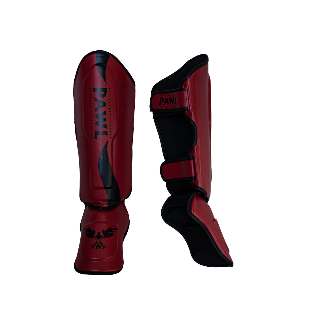 Canilleras Muay Thai rojas vista lateral con ajuste de velcro